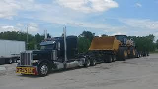 Peterbilt 389 Hauling Brand New Caterpillar 986K Loader