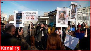 Dozens of people protest near the U.S. embassy in Kyiv against Trump’s anti-Ukraine decisions