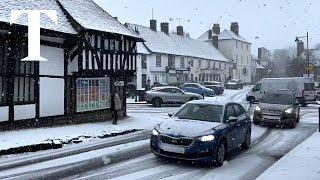 UK weather: Snow falls in London and southeast