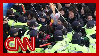 Arrest of impeached South Korean president suspended after tense standoff