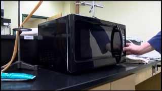 E. Texas students modifying microwave for chemistry research