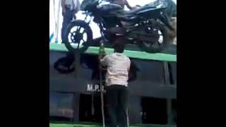 Man balances Motor on head in India