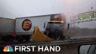 Raw: Truck Jumps Highway Barrier And Collides With Car | NBC News