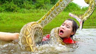 Horrified rescue ethnic girl attacked by a giant python underwater.