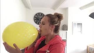 (91) Hot girl blow to pops a huge yellow balloon