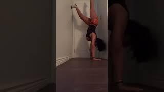 girl with big tits is doing a handstand