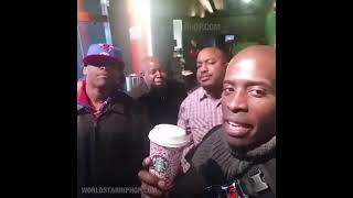 Black men holding a Starbucks cup!