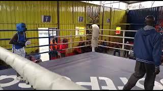 13 years old John maina of ruaraka boxing club in blue