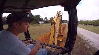 Backhoe Digging A Ditch