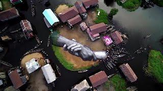 Giant hands painted at former African slave hub