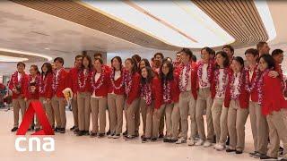 Singapore's swimmers return home