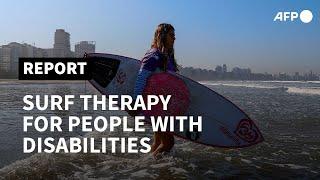 Surfing the waves: a form of therapy for people with disabilities in Brazil | AFP