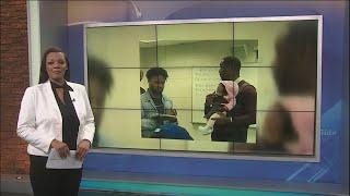 Morehouse College Prof holds baby