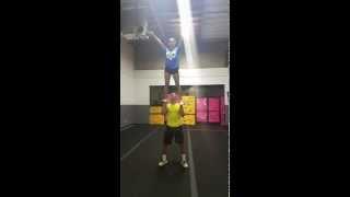 High School Co-Ed partner stunt toss hands to lib