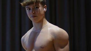 15 years old teen boy flexing muscle