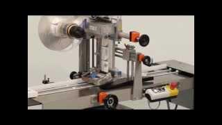 HERMA - Top labelling machine with product alignment