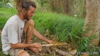 Using coconut stalks.  Tropical survival skills.