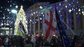 Thousands celebrate new year in front of parliament in Georgia capital as protests continue