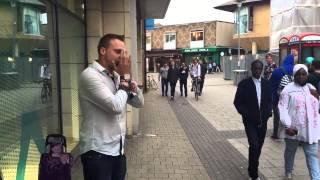 This guy helps out a busker in Cambridge