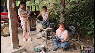 Mechanic girl repairs personal rice milling machine