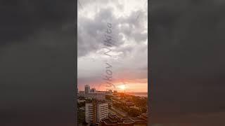 Vertical video. Ulyanovsk, Russia. After the night, the sun rises. Rain falls over the city. Obel...