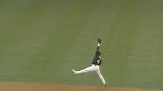 Miguel Tejada makes leaping grab, turns two