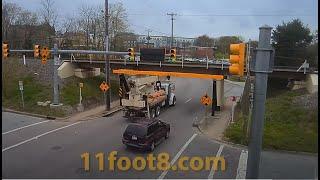 Crane truck almost defeats the 11foot8+8 bridge