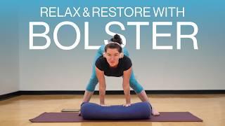 7 Restorative Yoga Poses With a Bolster