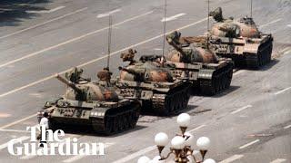 Tank Man: hero of 1989 Tiananmen protest stands in front of tanks – archive video
