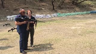 PNP Chief Ronald Dela Rosa firing a Negev Machine Gun