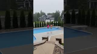 Couples Jumping Together in Pool During Rain Storm #shorts