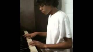 Kylan Halfhill playing on the piano