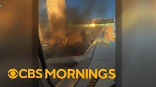 Passengers describe terrifying moments plane catches fire at Denver airport