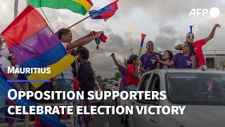 Mauritius opposition supporters celebrate an expected election victory | AFP