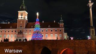 Walking in the evening Warsaw, Poland. Christmas atmosphere. Traveling around Europe in December