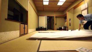 Making up a futon bed at Japanese traditional Ryokan