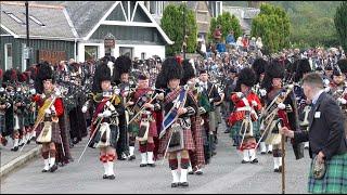 Drum Majors lead the massed Pipes and Drums on the march to 2022 Braemar Gathering in Scotland