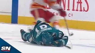 Flames' Brayden Pachal Drops the Gloves After Massive Hit on Sharks' Carl Grundstrom