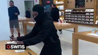 Brazen thief steals over 40 iPhones from Apple store as police car is parked outside | SWNS