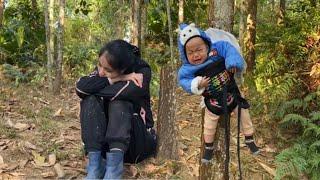 single mother leads young child deep into the forest to find food