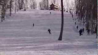 Yuri skiing down the slope on S-Nezhnaya