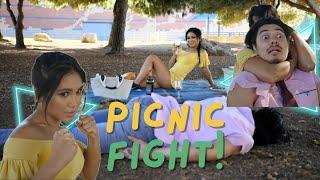 Intense Picnic Showdown: Muscular Male vs. Tiny Girl