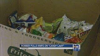 Robber pulls knife on "candy lady"