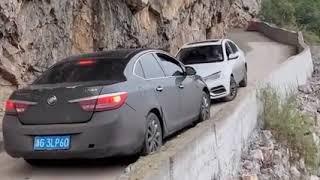 Chinese drivers meet on the narrow mountain road