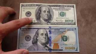 Comparing the new $100 US dollar (Oct 2013) with the old $100 bill.