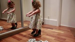 Little Girl Dances in Front of Mirror