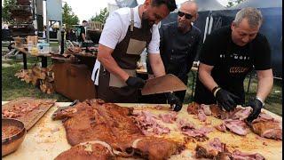 Street Food in Bucharest, Romania. Giant Wheel for Grilling and Roasting Pigs. Grillfest