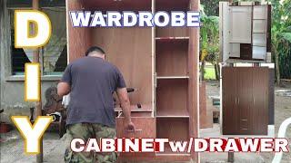WARDROBE CABINET WITH DRAWER AND HANGING ROD.