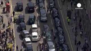 Europe's taxi drivers in traffic stopping protest against mobile phone app Uber