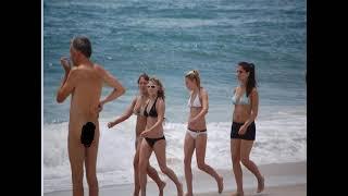 Nude beach Naked man among clothed girls CFNM on beach , playa nudista, un hombre con muchas mujeres